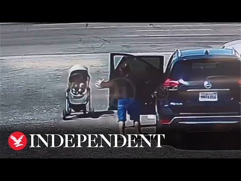 Moment bystander saves baby in runaway pushchair from rolling into traffic