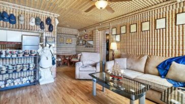 casa revestida com latas de cerveja