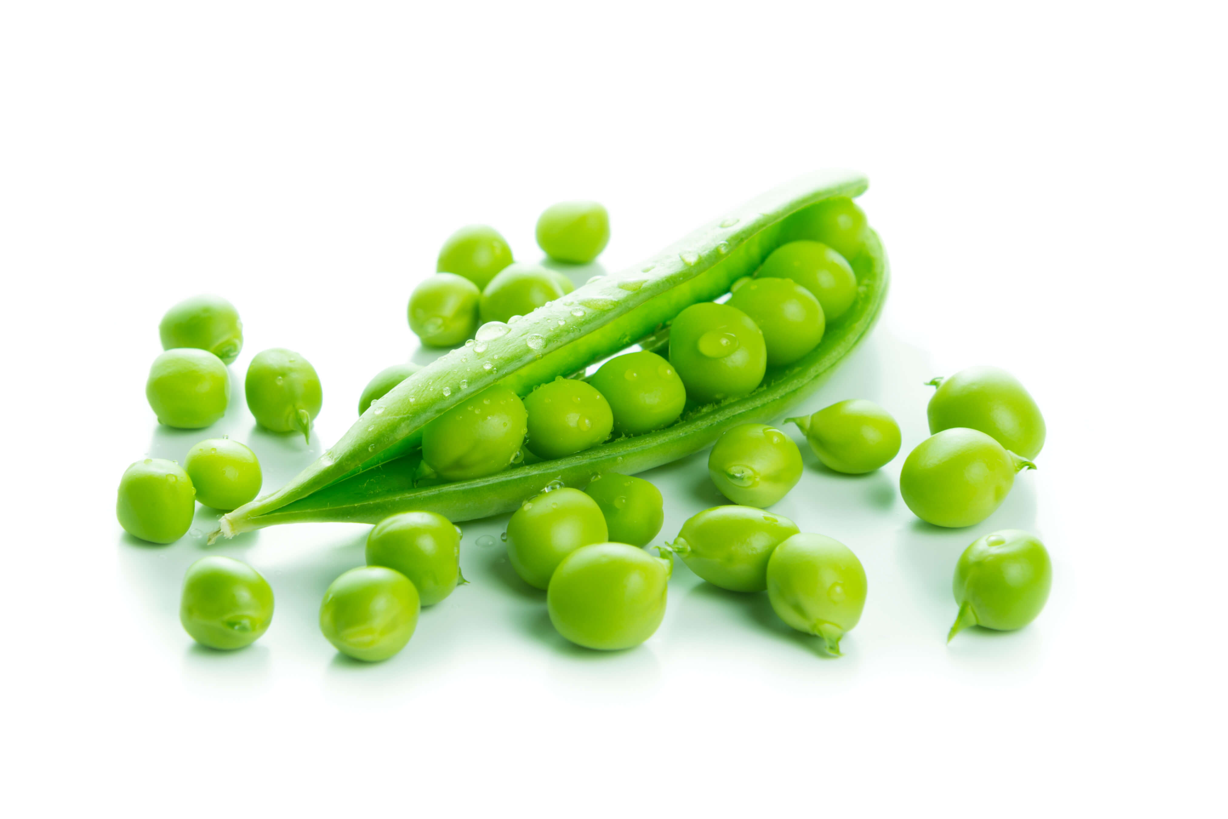 Peas on isolated white background with some seed out of pod