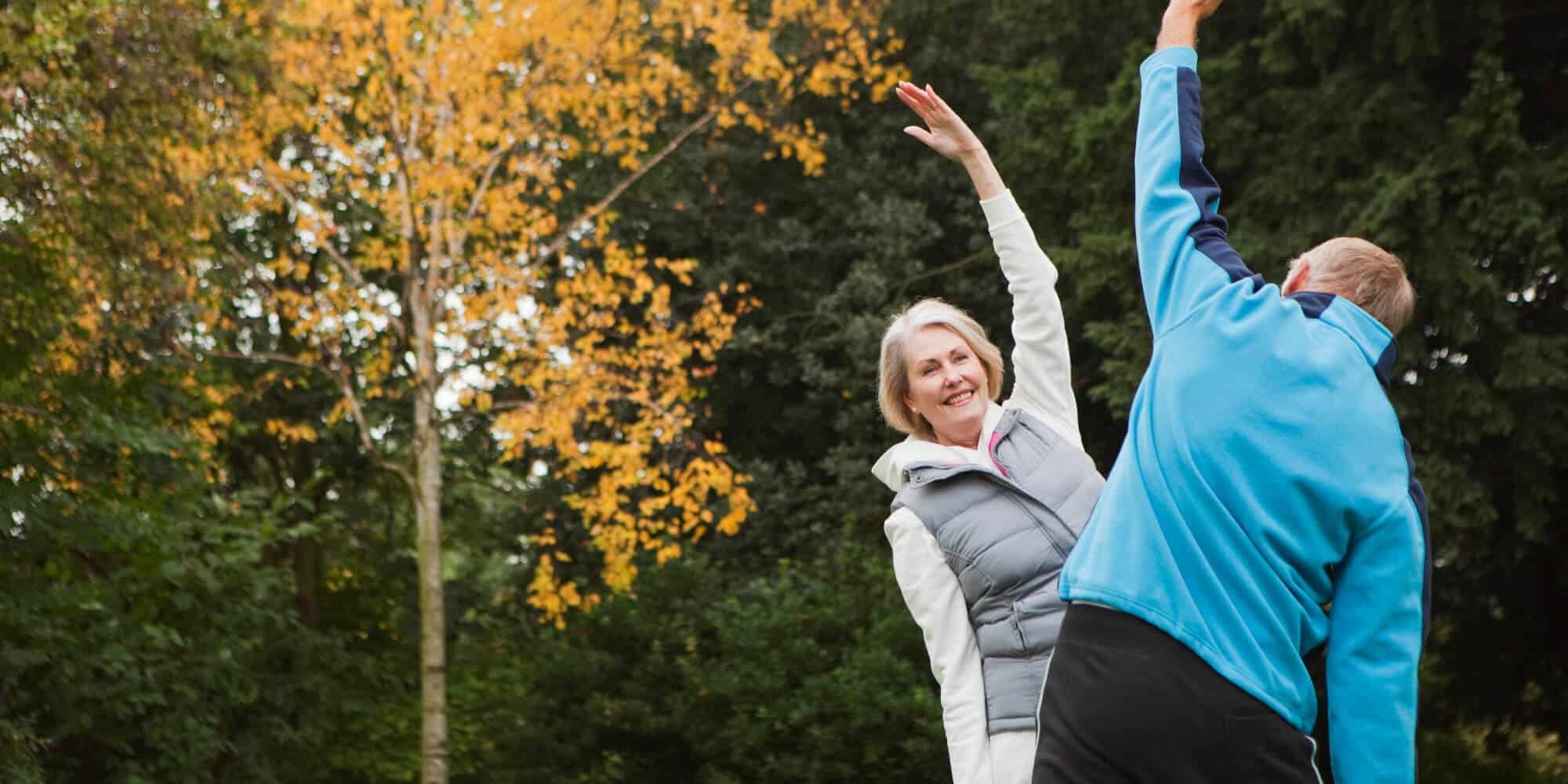 Senior couple doing stretching exercise